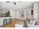 Inviting living room with hardwood floors, built-in shelving, kitchen view, neutral paint, and lots of natural light at 167 Freyer Ne Dr, Marietta, GA 30060
