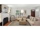 Comfortable living room with a fireplace, large windows, neutral tones, and ample seating at 167 Freyer Ne Dr, Marietta, GA 30060