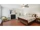 Cozy main bedroom with a ceiling fan, fireplace, and access to natural light at 167 Freyer Ne Dr, Marietta, GA 30060