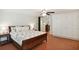 Comfortable main bedroom featuring a ceiling fan, built in wardrobe, and brick flooring at 167 Freyer Ne Dr, Marietta, GA 30060