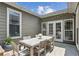 Charming outdoor patio with a rustic wooden dining set, perfect for al fresco meals and gatherings at 167 Freyer Ne Dr, Marietta, GA 30060