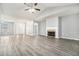 Living room with hardwood floors, fireplace and natural light coming through the windows at 181 Paradise Pointe, Douglasville, GA 30134