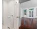 Well-lit powder room featuring a modern sink and fixtures, with a glimpse into a sunlit room at 33 Maddox Dr, Atlanta, GA 30309