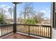 Spacious back porch with wooden railings and flooring providing an outdoor relaxing space with a view of the yard at 971 Boulevard Se # A, Atlanta, GA 30312
