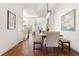 Hallway shot into the dining room showing hardwood floors and natural light illuminating the open concept of the home at 971 Boulevard Se # A, Atlanta, GA 30312