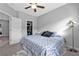 Bedroom featuring neutral paint colors, an open closet with hangers, and modern lamp at 2090 Callaway Nw Ct, Atlanta, GA 30318