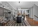 Spacious dining room featuring a modern table, stylish lighting, and open concept design at 2090 Callaway Nw Ct, Atlanta, GA 30318