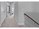 Upstairs hallway with grey walls, carpeted floors, white trim and doors leading to other rooms at 2090 Callaway Nw Ct, Atlanta, GA 30318