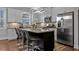 Modern kitchen features stainless steel appliances, granite countertops, a central island, and bar stool seating at 2090 Callaway Nw Ct, Atlanta, GA 30318