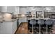 Well-lit kitchen with gray granite countertops, white cabinets, stainless steel appliances, and hardwood floors at 2090 Callaway Nw Ct, Atlanta, GA 30318