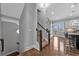 Bright living area with modern decor, hardwood floors, and bar-stool seating to an open kitchen at 2090 Callaway Nw Ct, Atlanta, GA 30318