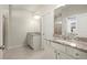 Bright bathroom featuring double vanity with granite countertops and tile flooring at 2569 Village Park Bnd, Duluth, GA 30096