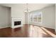 Bright living room with hardwood floors, fireplace, and large windows at 2569 Village Park Bnd, Duluth, GA 30096