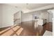 Spacious living room featuring hardwood floors that flow into the kitchen area at 2569 Village Park Bnd, Duluth, GA 30096