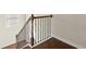 Staircase with wooden railing and decorative iron spindles to add a touch of elegance at 2569 Village Park Bnd, Duluth, GA 30096