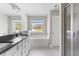 Elegant bathroom features double vanity, soaking tub, and tiled shower with glass door at 3787 Lockaby Way, Lawrenceville, GA 30044