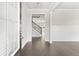 Inviting entryway with gleaming hardwood floors and view of staircase at 3787 Lockaby Way, Lawrenceville, GA 30044