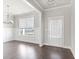 Bright living area features hardwood floors, large windows, and classic white trim at 3787 Lockaby Way, Lawrenceville, GA 30044