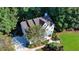 Aerial view of home with lush landscaping and green lawn at 5760 Windjammer Pt, Cumming, GA 30041