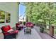 Back Deck with outdoor furniture with chairs and sofas on a light green house at 5760 Windjammer Pt, Cumming, GA 30041