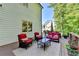 Back Deck with outdoor furniture with chairs and sofas on a light green house at 5760 Windjammer Pt, Cumming, GA 30041