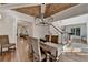 Well-lit dining room featuring a coffered wood ceiling, shiplap walls, and wood floors at 5760 Windjammer Pt, Cumming, GA 30041