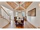 Stylish dining room features a coffered wood ceiling, shiplap walls, and hardwood floors at 5760 Windjammer Pt, Cumming, GA 30041