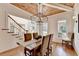 This dining area offers a wooden coffered ceiling, shiplap walls, and hardwood floors at 5760 Windjammer Pt, Cumming, GA 30041