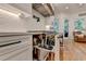 Innovative kitchen storage featuring a pull-out drawer with knife block and utensil organization at 5760 Windjammer Pt, Cumming, GA 30041