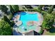 Aerial view of a large community pool surrounded by lounge chairs at 5760 Windjammer Pt, Cumming, GA 30041