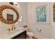 Well-lit powder room features modern fixtures and classic shiplap design at 5760 Windjammer Pt, Cumming, GA 30041