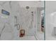 Large glass shower with marble detail, shower niche, and rain shower head at 5760 Windjammer Pt, Cumming, GA 30041