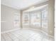 Sunlit breakfast nook with bright windows and tiled floor at 9811 Spyglass Dr, Villa Rica, GA 30180