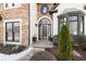 Close up of front door with elegant architectural details and manicured landscaping at 9811 Spyglass Dr, Villa Rica, GA 30180