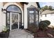 Close up of front door and bay window with tasteful landscaping at 9811 Spyglass Dr, Villa Rica, GA 30180