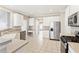 Modern kitchen with stainless steel appliances, light countertops and white cabinets at 9811 Spyglass Dr, Villa Rica, GA 30180