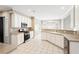 Well-lit kitchen features an oven, stainless steel appliances, and white cabinets at 9811 Spyglass Dr, Villa Rica, GA 30180