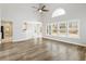 Open-concept living room with a vaulted ceiling, natural light, and hardwood floors at 9811 Spyglass Dr, Villa Rica, GA 30180