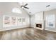 Spacious living room with a vaulted ceiling, fireplace, and abundant natural light at 9811 Spyglass Dr, Villa Rica, GA 30180