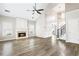 Spacious living room featuring a fireplace, hardwood floors, and vaulted ceilings at 9811 Spyglass Dr, Villa Rica, GA 30180