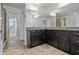 Bathroom includes double vanity with dark cabinetry and granite countertops at 278 Goodson Nw Way, Atlanta, GA 30309