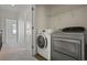 Laundry room with modern washer and dryer and wire shelving at 278 Goodson Nw Way, Atlanta, GA 30309