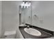 Clean, well-maintained bathroom with vanity, toilet, and sleek mirror, ready for personal touches at 2822 Ward Lake Way, Ellenwood, GA 30294