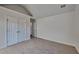 This bedroom features neutral carpeting, vaulted ceilings, double closets and plenty of natural light at 2822 Ward Lake Way, Ellenwood, GA 30294