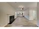 Open-concept living area with fireplace and new floors, ideal for entertaining and Gathering gatherings at 2822 Ward Lake Way, Ellenwood, GA 30294