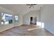 This spacious room features large windows for natural light and beautiful new floors throughout at 2822 Ward Lake Way, Ellenwood, GA 30294