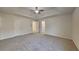 Spacious main bedroom with new carpet, ceiling fan, and ensuite bath at 2822 Ward Lake Way, Ellenwood, GA 30294