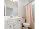 Bathroom with a white vanity, toilet, and shower with a pink curtain rod at 238 Gallant Fox Way, Acworth, GA 30102