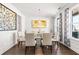 Elegant dining room with decorative walls, modern art, and a glass table at 238 Gallant Fox Way, Acworth, GA 30102