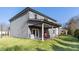 View of the back of the house with a covered patio and an expansive backyard at 238 Gallant Fox Way, Acworth, GA 30102